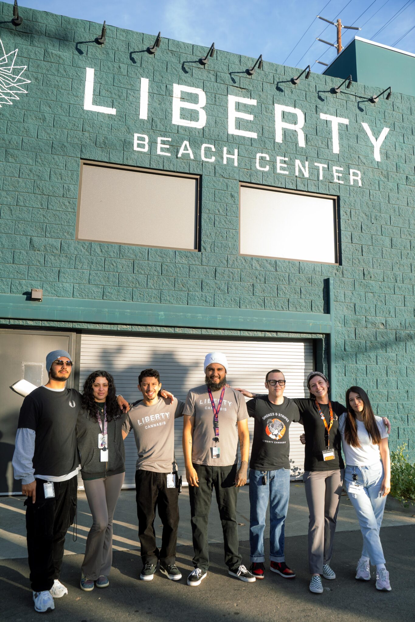 Team members outside Liberty Beach Center